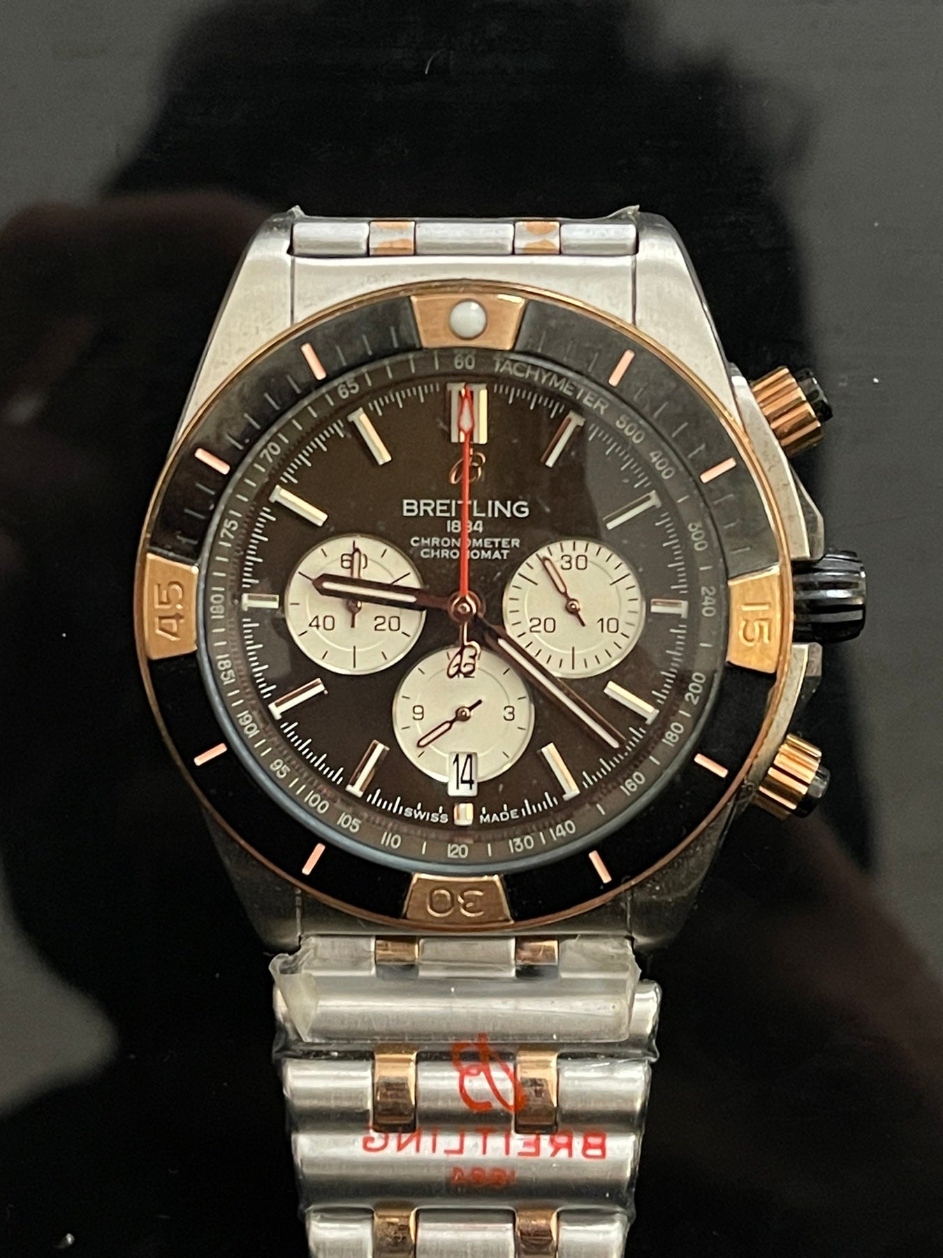 Luxury Chronomat 44mm men's automatic watch in two-tone steel and gold with black dial and chronograph