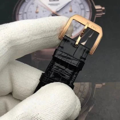 Luxury watch photography of the IWC Portuguese Chronograph Classic Gold IW390405 on a wrist, showcasing its 14.5mm elegant profile.