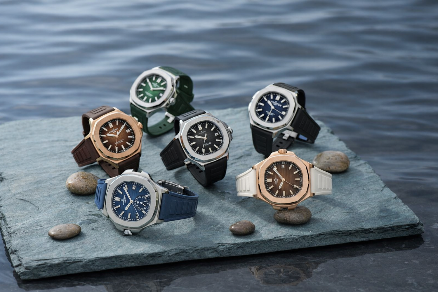 Patek Aquanaut Luxury Sport Watch Collection on Slate by Water