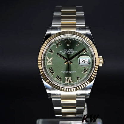 Detailed view of the Rolex 126233 Olive Green dial featuring 18k yellow gold hands, Roman numerals (or baton markers), and date window.