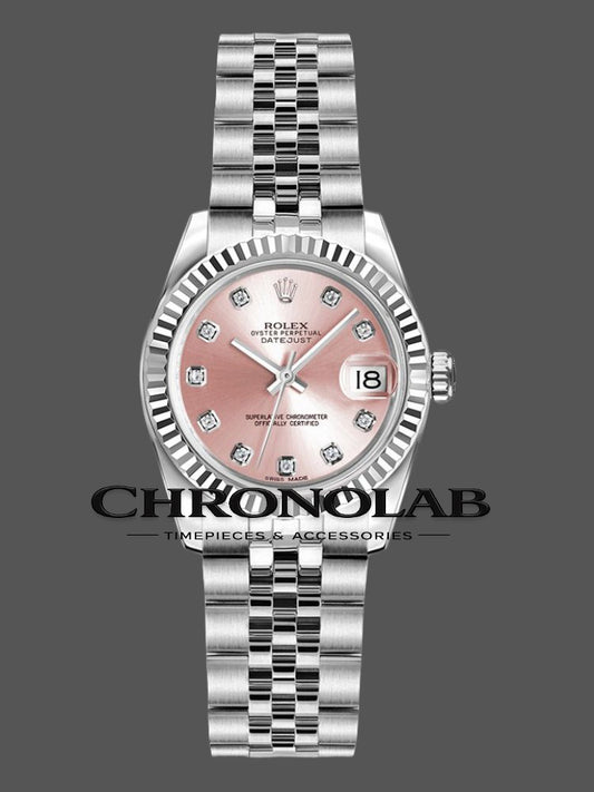 Detailed view of the Rolex 179174 pink dial featuring factory-set diamond indexes and the iconic Cyclops date magnifier window.