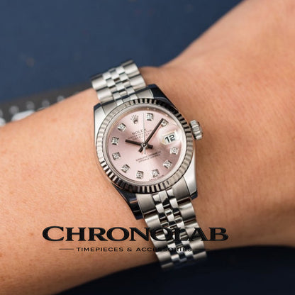 Rolex Datejust 26mm 179174 pink diamond dial on a lady's wrist, showing the elegant proportions of the 26mm Oyster case and Jubilee bracelet.