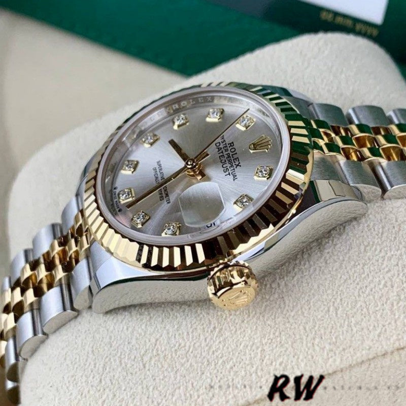 Close-up of the Rolex 279173 silver dial featuring diamond-set indexes in 18k yellow gold settings and date display.