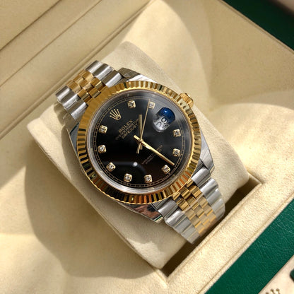 Close-up of the Rolex 126233 black diamond dial featuring 18k yellow gold settings and the signature Cyclops date window.