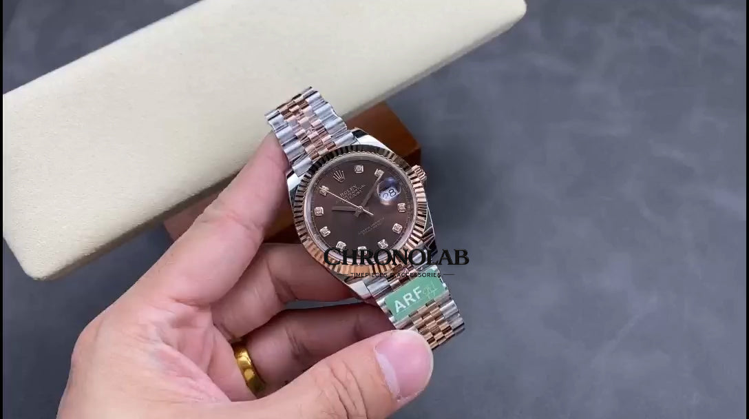 Close-up of the Rolex 126331 chocolate dial featuring factory diamond hour markers in 18k gold settings and sunray finish.