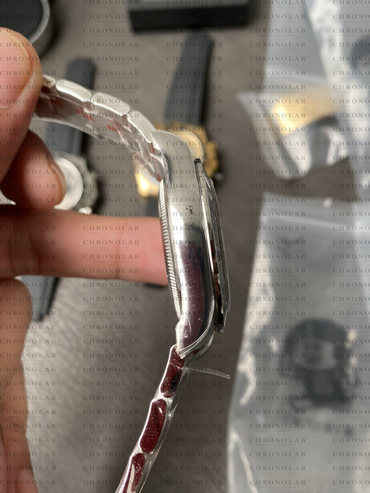 Angled view highlighting the threaded Triplock winding crown and screw-down chronograph pushers on Rolex Daytona 126500LN Clean Factory
