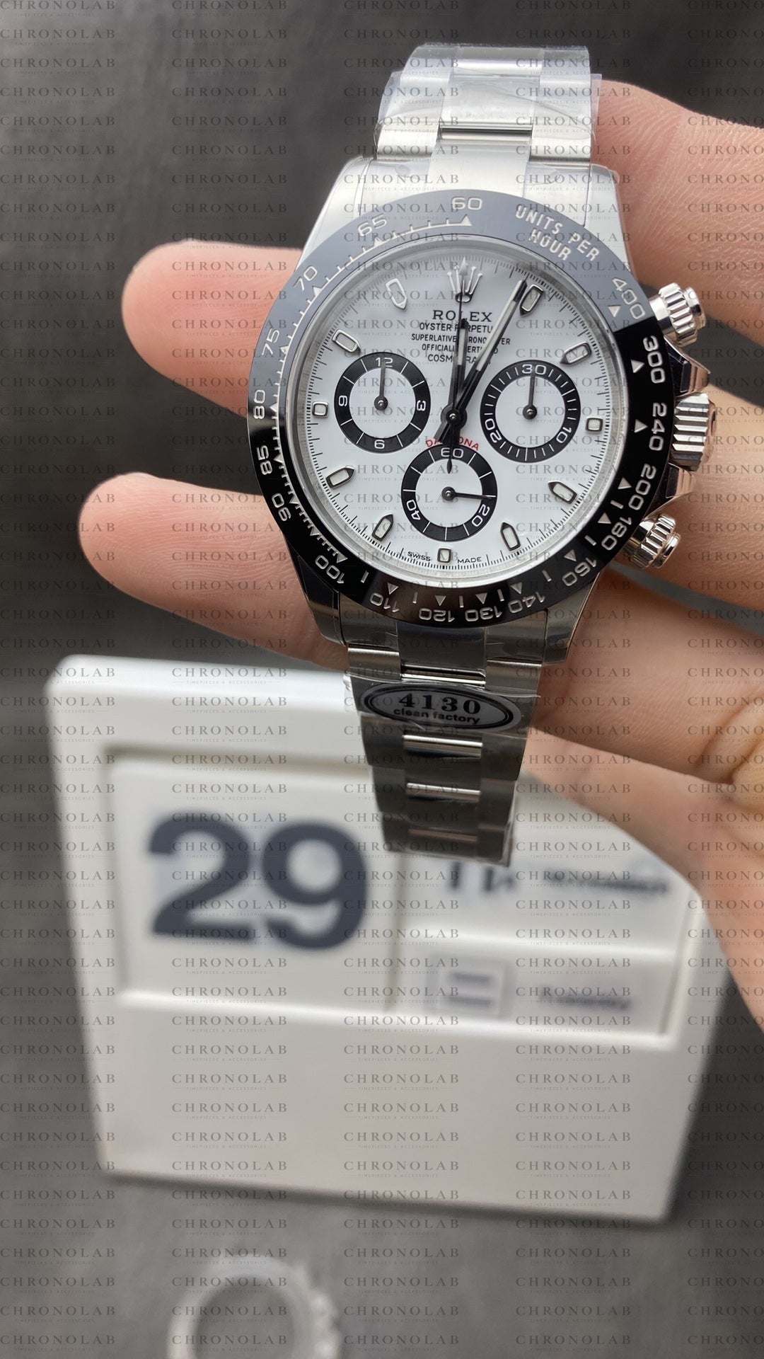 Front view of Rolex Daytona 116500 White Dial Panda on display stand with factory protective plastics from Clean Factory