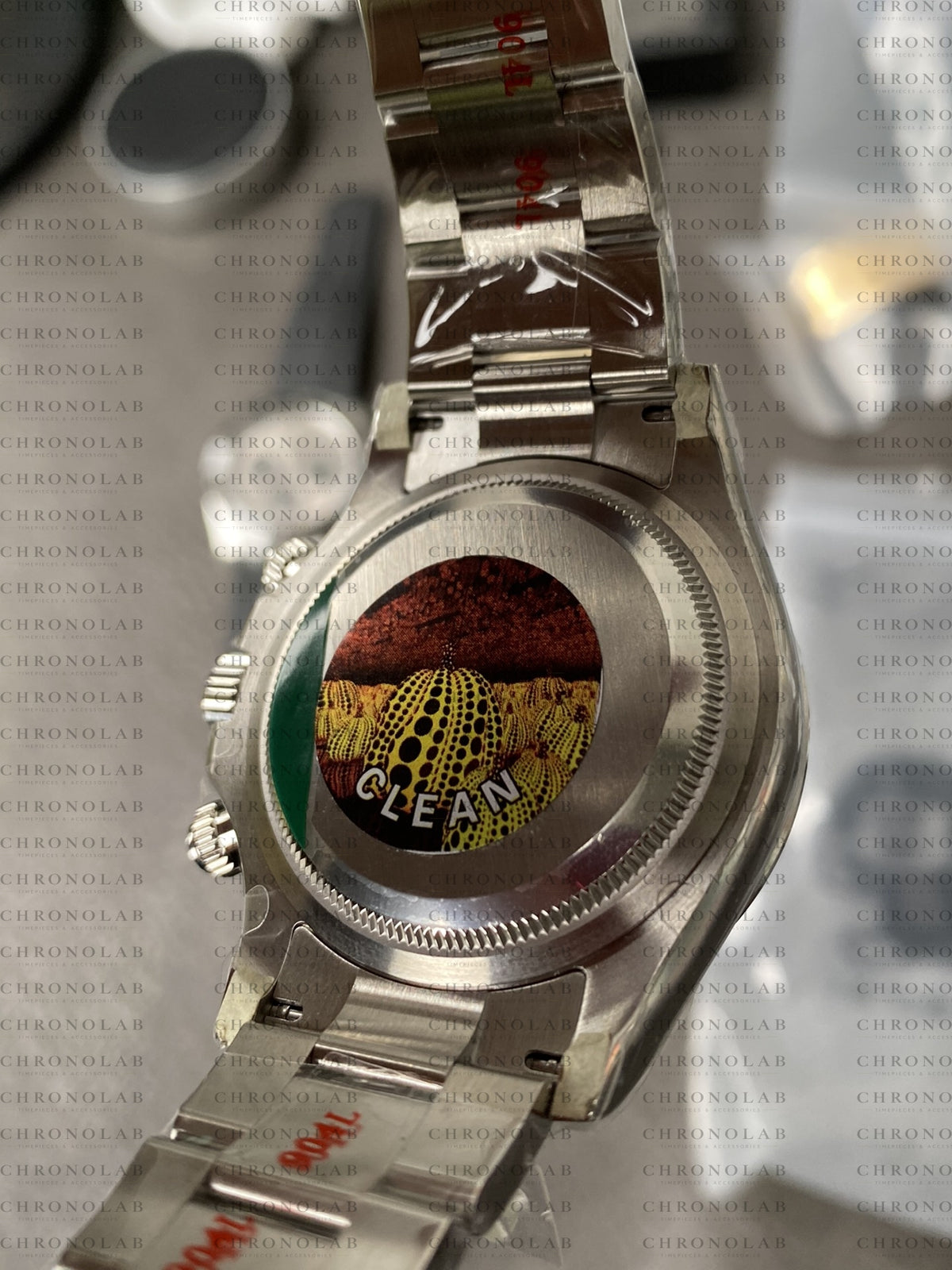 Close-up of the 904L Oystersteel folding Oysterlock safety clasp with clean coronet engraving on Rolex Daytona 126500LN Clean Factory