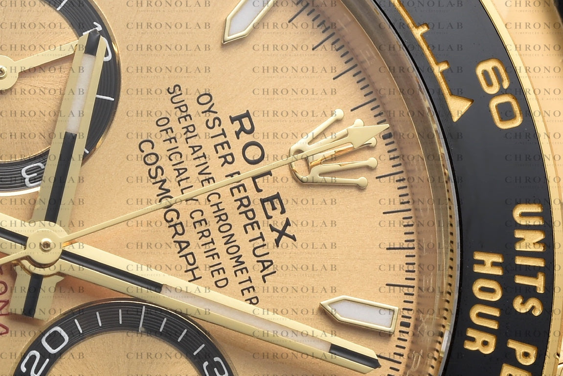 Macro view highlight of the black Cerachrom ceramic bezel with gold-coated tachymetric scale engraving on Rolex Daytona 126518LN Clean Factory
