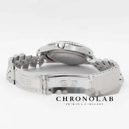 Period correct folding clasp with embossed Rolex crown logo on vintage Oyster steel bracelet 1675