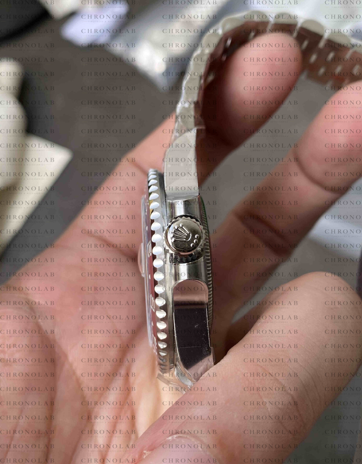 Detailed view of the 904L steel folding Oysterlock safety clasp secured on the wrist for Rolex GMT-Master II Pepsi Clean Factory V3